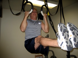 Roger doing pull ups on the rings